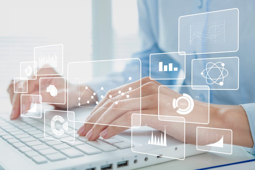 Human hands working on a modern laptop